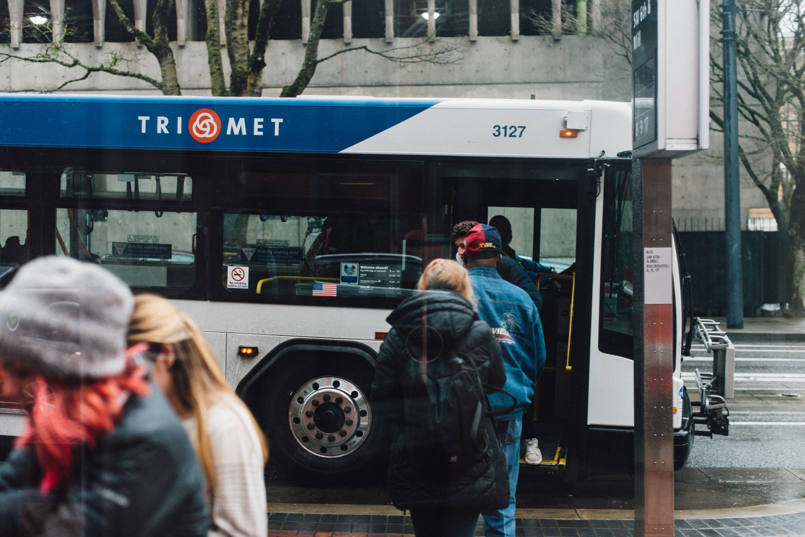 people boarding bus